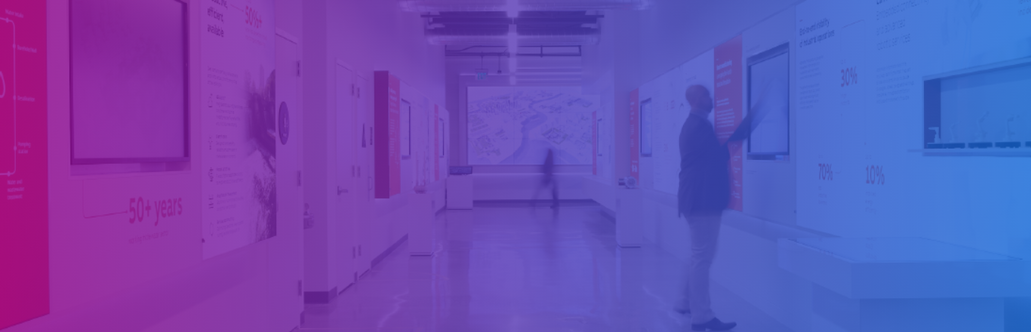 A person walking in a hallway

Description automatically generated